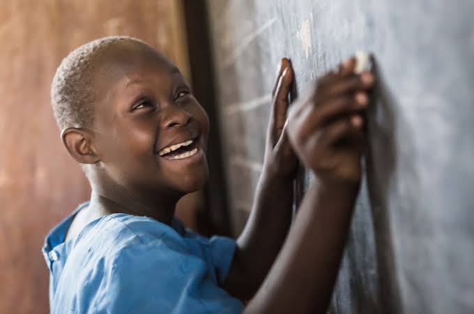 A smiling boy looking up
